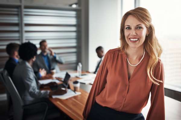 What We Do 1 confident professional woman smiling in a modern o 2026 09 25 04 37 23 utc